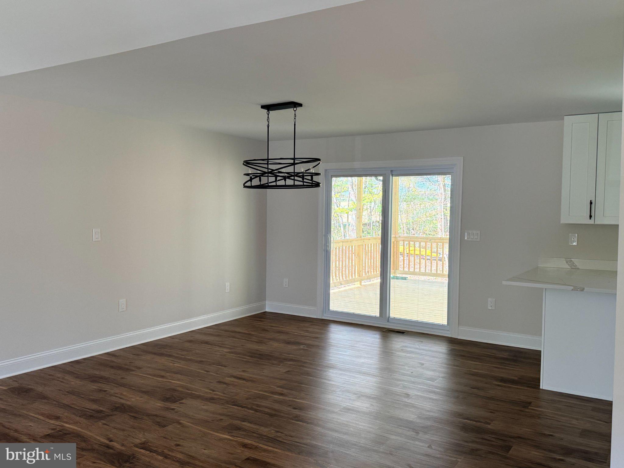 206 Saylers Creek Road Locust Grove, VA 22508 - Photo 26 of 49 a view of an empty room with wooden floor and a window