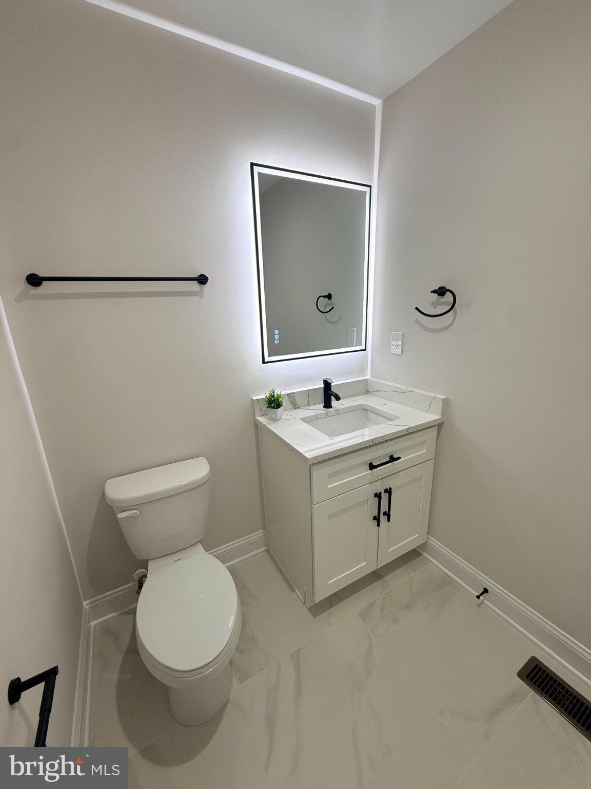 206 Saylers Creek Road Locust Grove, VA 22508 - Photo 27 of 49 a bathroom with a toilet sink and mirror