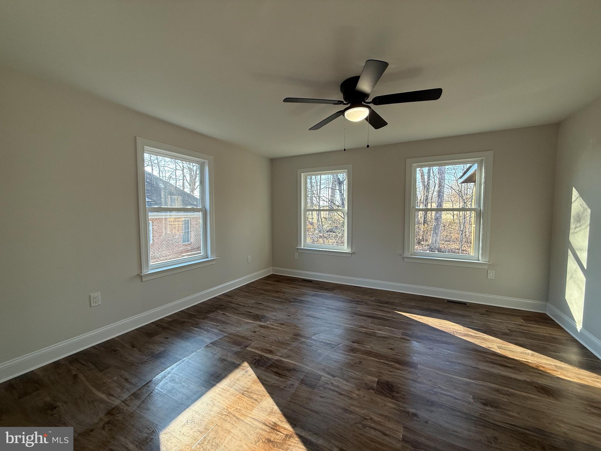 206 Saylers Creek Road Locust Grove, VA 22508 - Photo 30 of 42 a view of empty room with wooden floor and fan