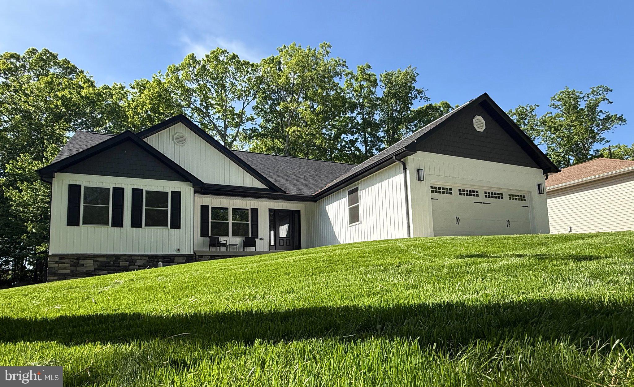 206 Saylers Creek Road Locust Grove, VA 22508 - Photo 3 of 49 Charming modern home with lush greenery.