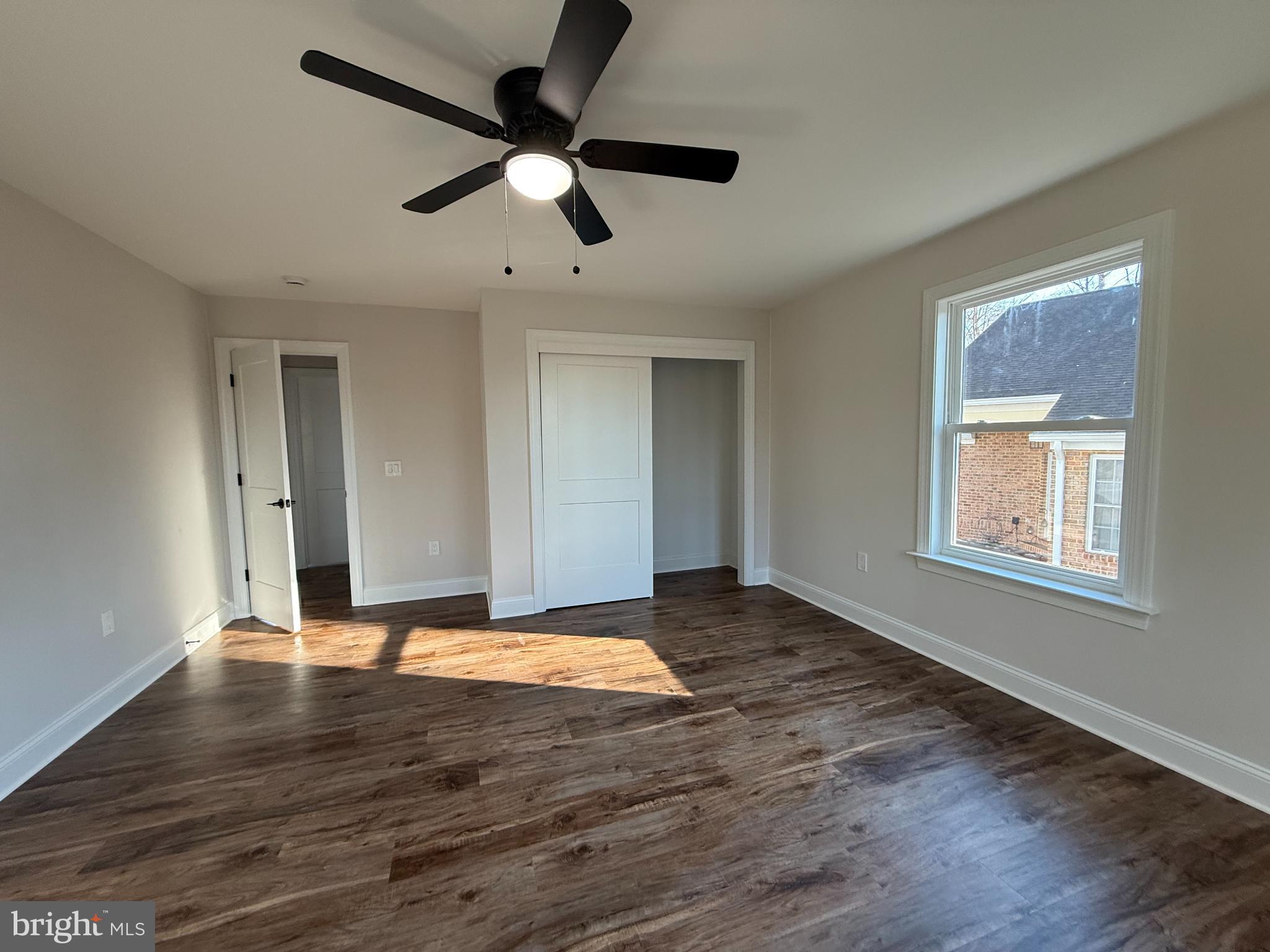 206 Saylers Creek Road Locust Grove, VA 22508 - Photo 31 of 42 a view of an empty room with wooden floor and a window
