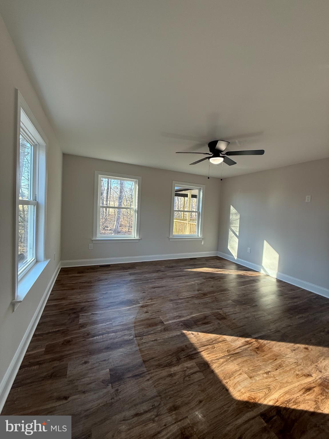 206 Saylers Creek Road Locust Grove, VA 22508 - Photo 33 of 42 a view of an empty room with window and wooden floor