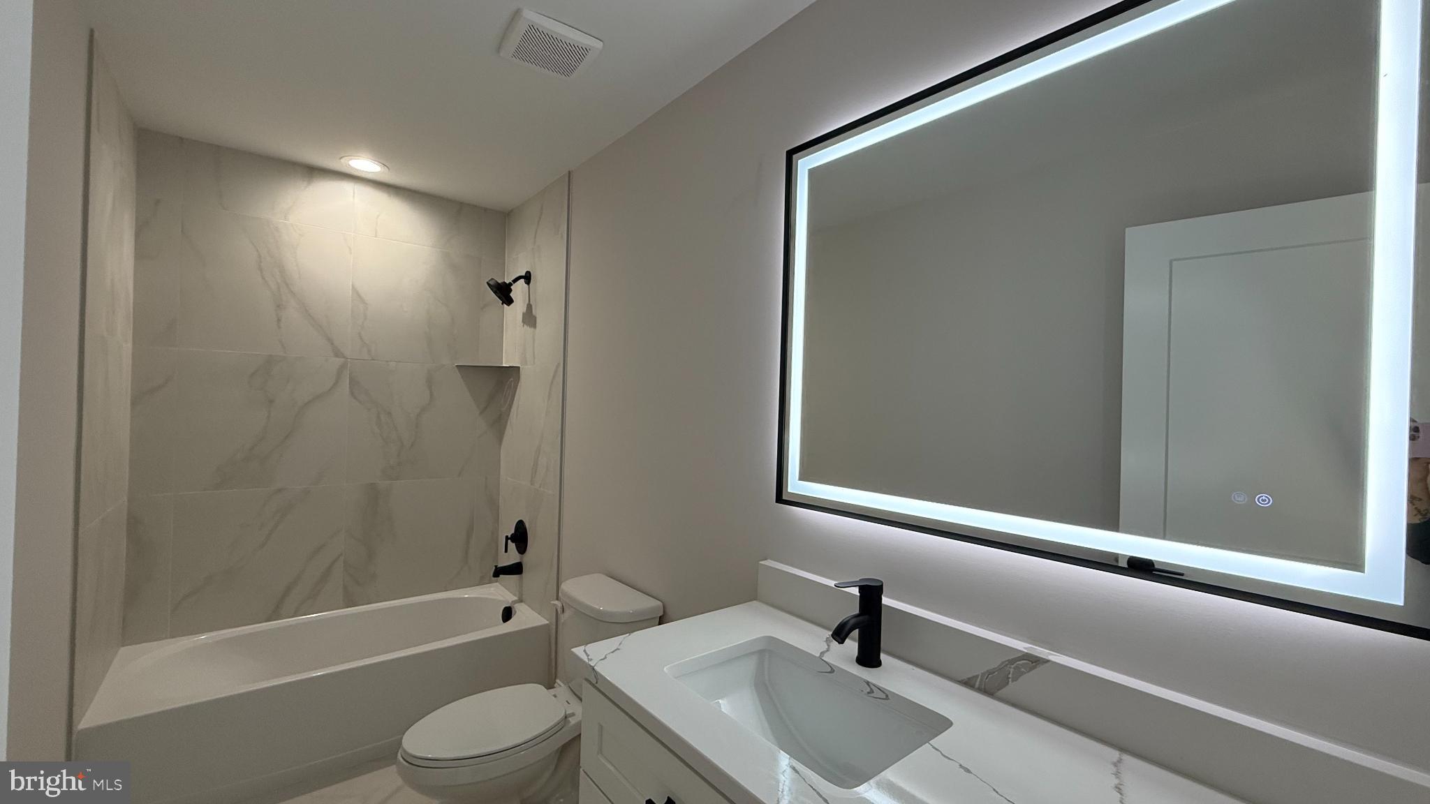 206 Saylers Creek Road Locust Grove, VA 22508 - Photo 36 of 42 a bathroom with a sink a toilet and shower