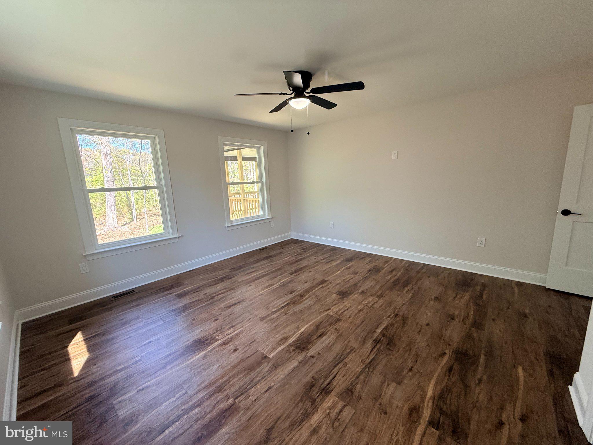 206 Saylers Creek Road Locust Grove, VA 22508 - Photo 39 of 49 wooden floor in an empty room with a window