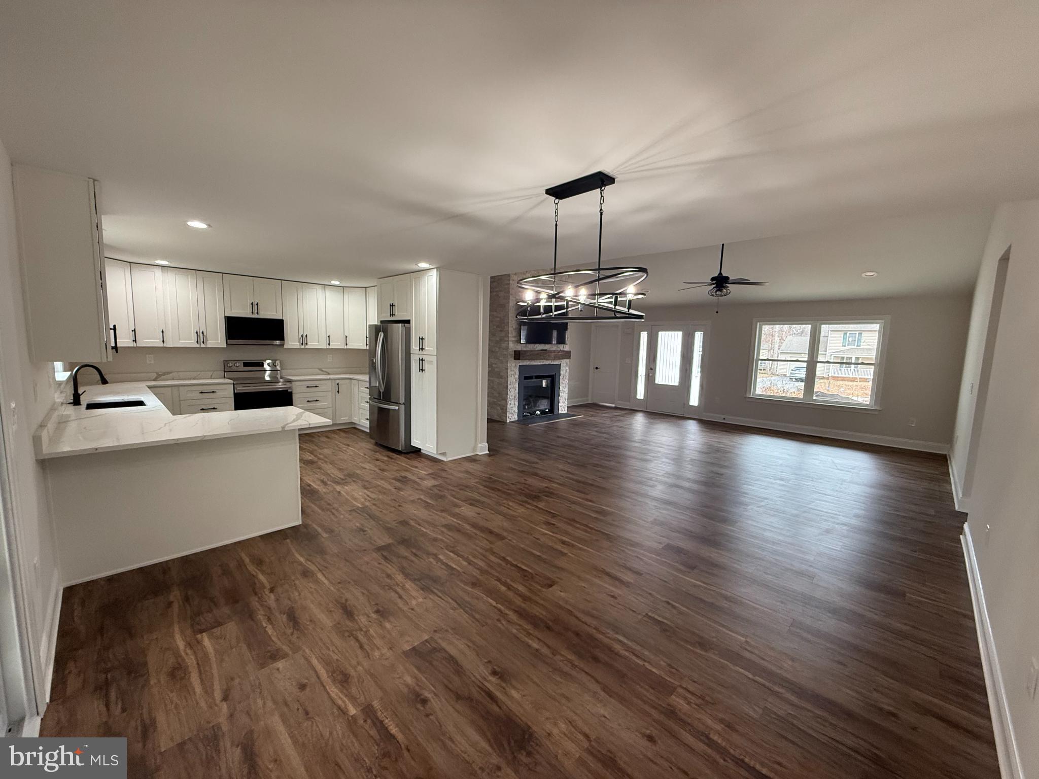 206 Saylers Creek Road Locust Grove, VA 22508 - Photo 4 of 42 a large kitchen with windows and wooden floor