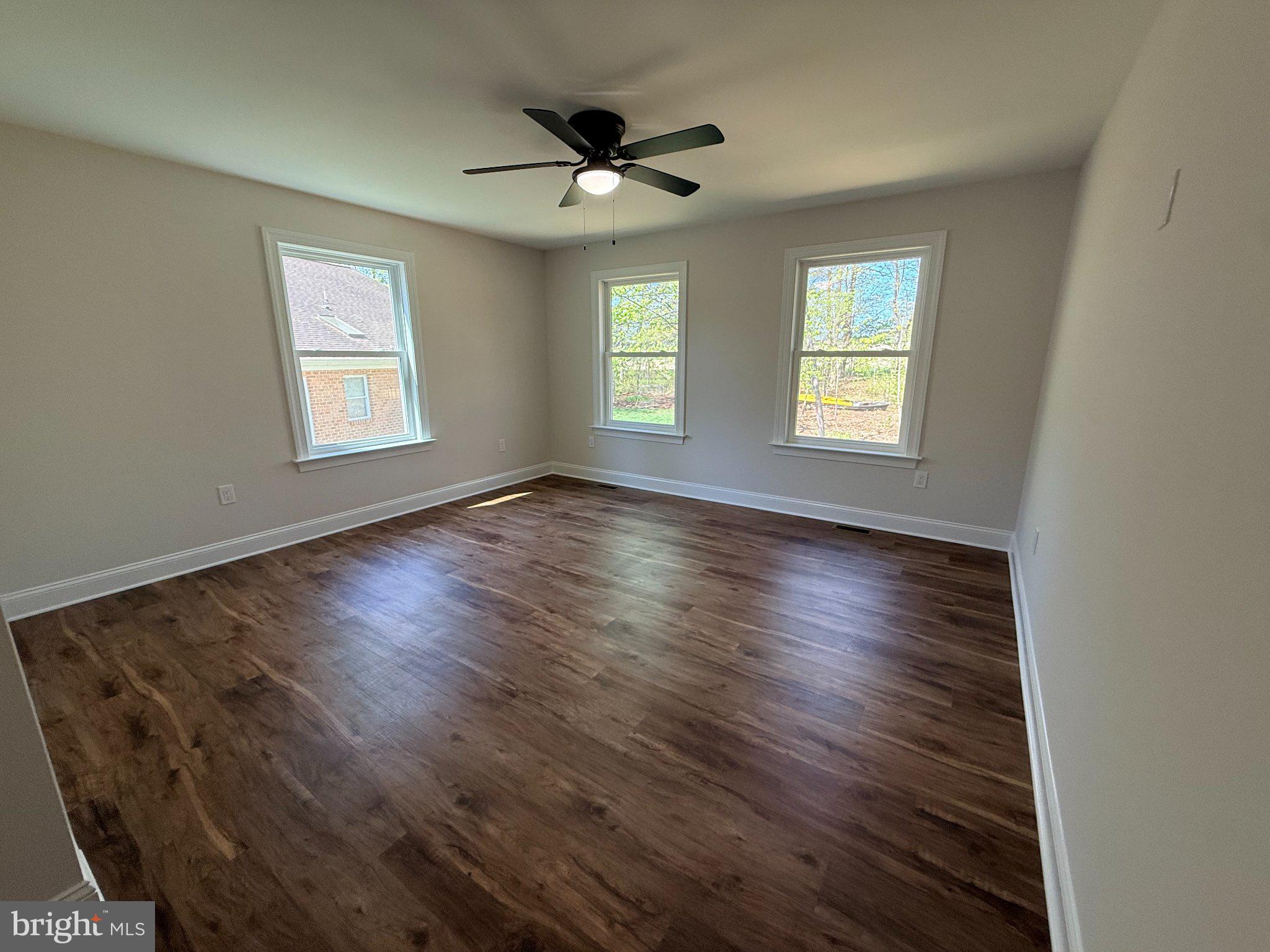 206 Saylers Creek Road Locust Grove, VA 22508 - Photo 41 of 49 a view of an empty room with wooden floor and a window