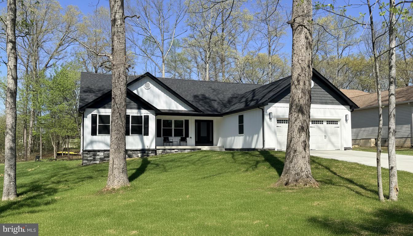 206 Saylers Creek Road Locust Grove, VA 22508 - Photo 5 of 49 a front view of a house with a yard