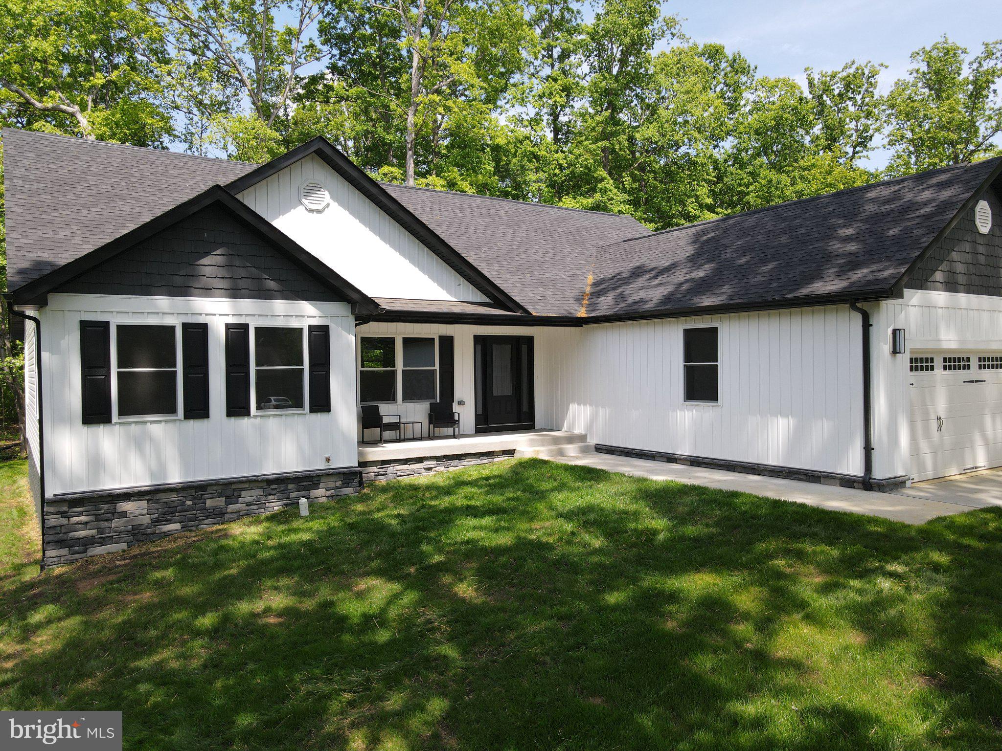 206 Saylers Creek Road Locust Grove, VA 22508 - Photo 7 of 49 Modern home nestled in lush greenery.
