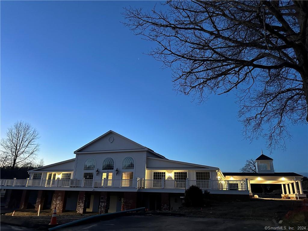 3 Banner Road, Unit 107 East Haddam, CT 06469 - Photo 7 of 18 a front view of a house with a yard