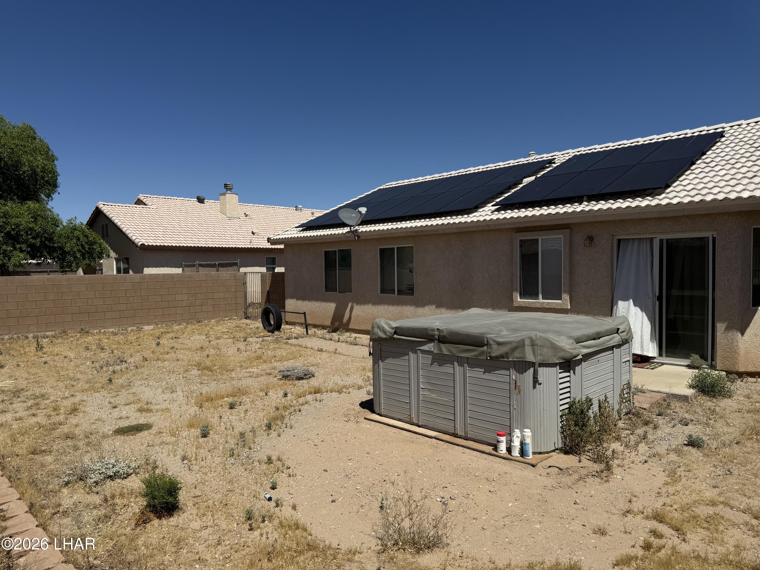 4897 South Rinaldi Drive Fort Mohave, AZ 86426 - Photo 19 of 22 a view of a house with wooden fence