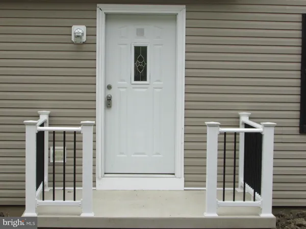 a view of a brick house with a large window
