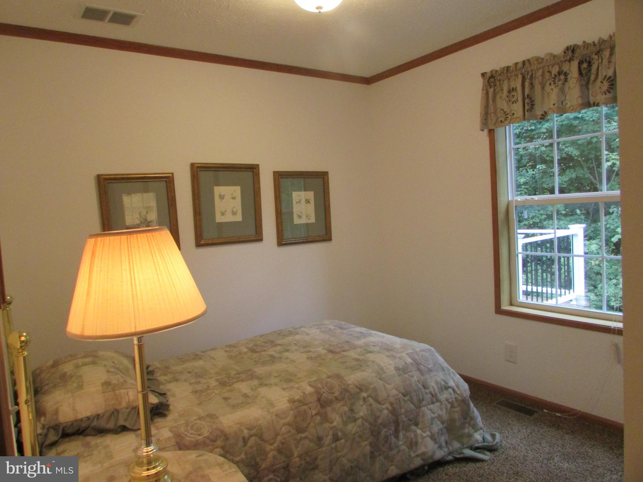 107 View Street Bellefonte, PA 16823 - Photo 29 of 42 a bedroom with a bed and a window