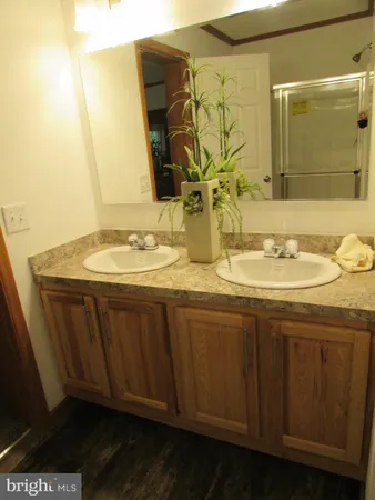 a white toilet sitting next to a sink