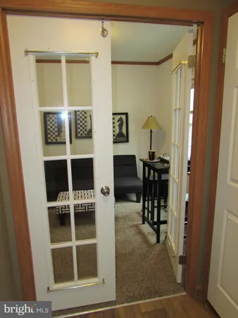 a view of a hallway with seating area