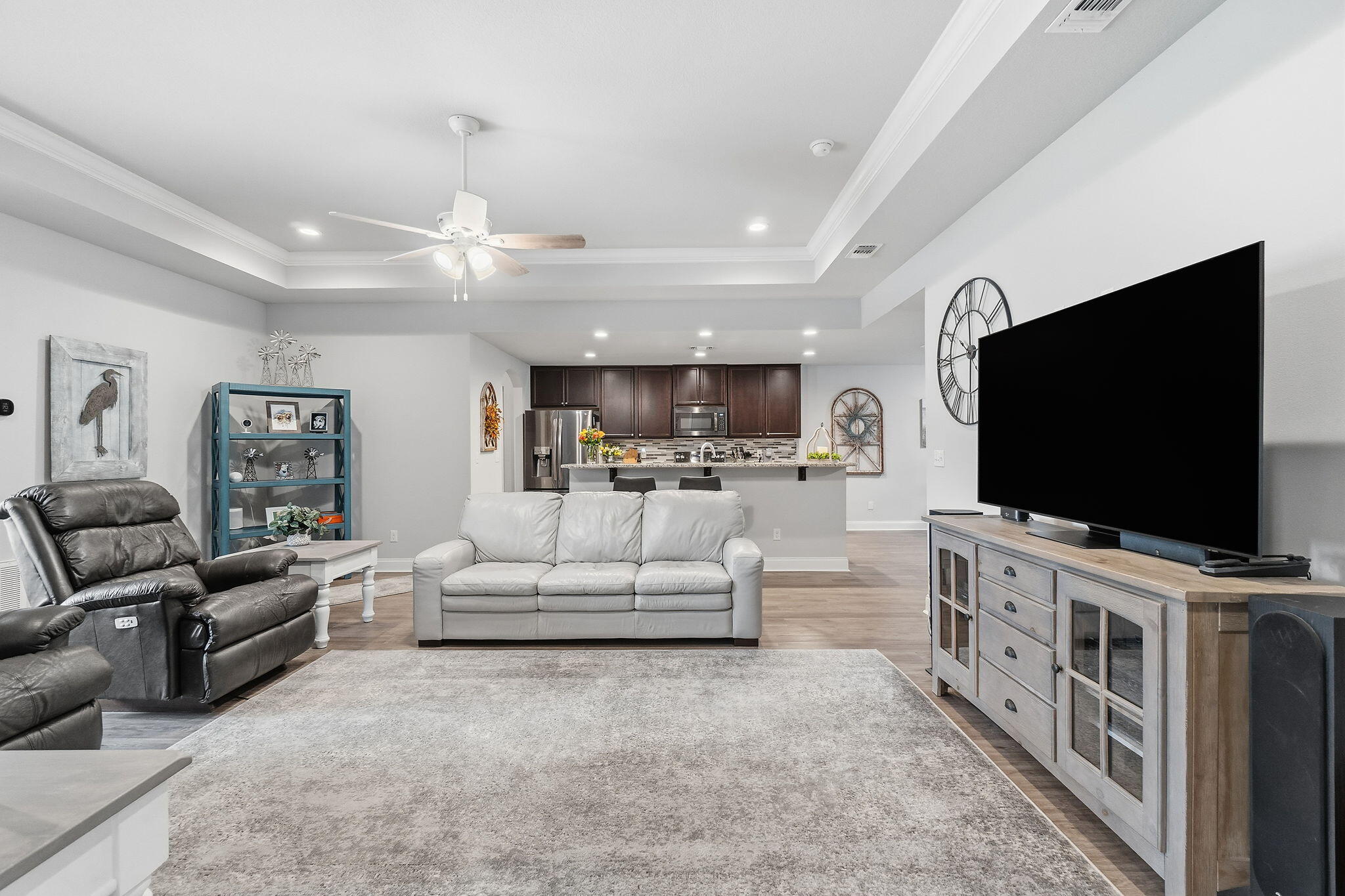 1827 Sundown Drive Navarre, FL 32566 - Photo 13 of 45 a living room with furniture and a flat screen tv