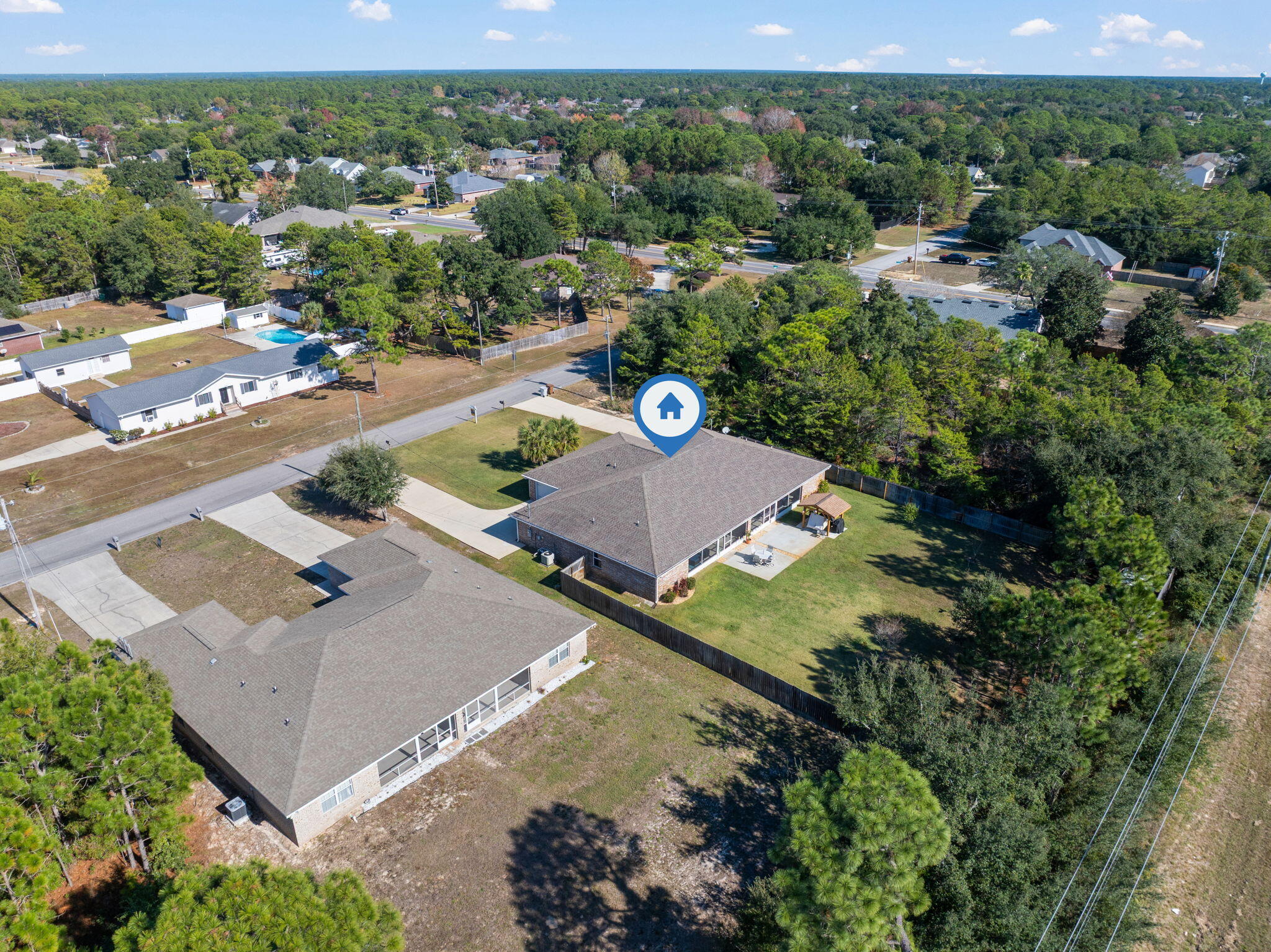 1827 Sundown Drive Navarre, FL 32566 - Photo 42 of 45 an aerial view of a house with a yard and lake view