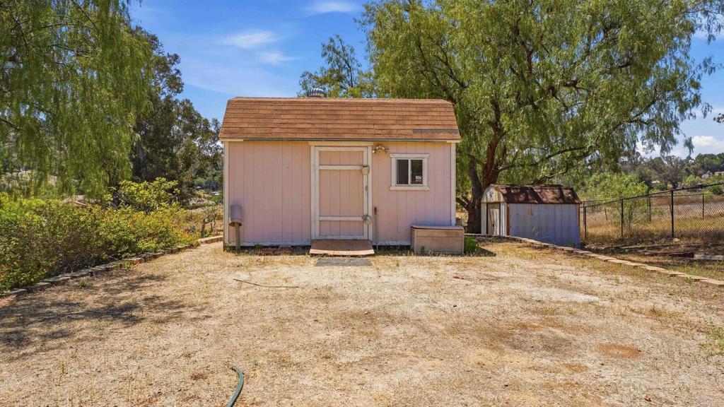 2527 Southern Oak Road Ramona, CA 92065 - Photo 40 of 56 a house with trees in front of it