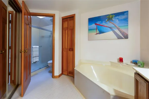 a bathroom with a tub and shower
