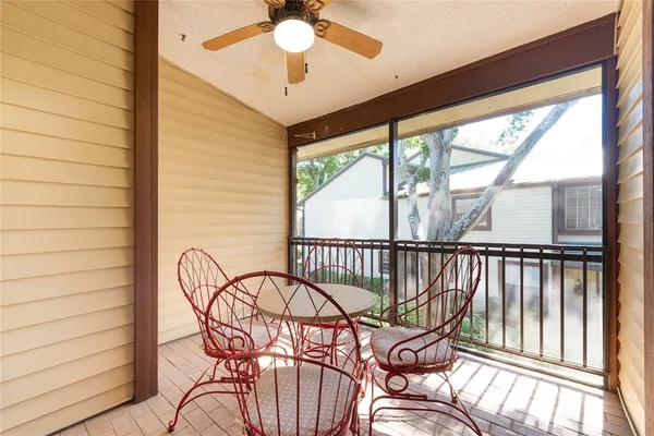 a view of a balcony with furniture