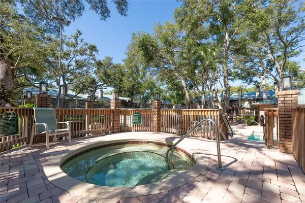 a swimming pool with outdoor seating and yard