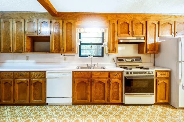 a view of kitchen with furniture and wooden floor