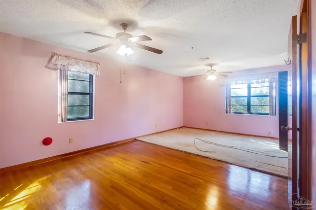 a bathroom with a bathtub and window