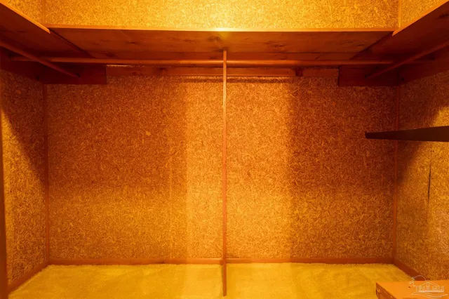 a view of a room with window and stairs