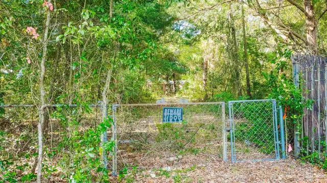 a backyard of a house with yard and outdoor seating