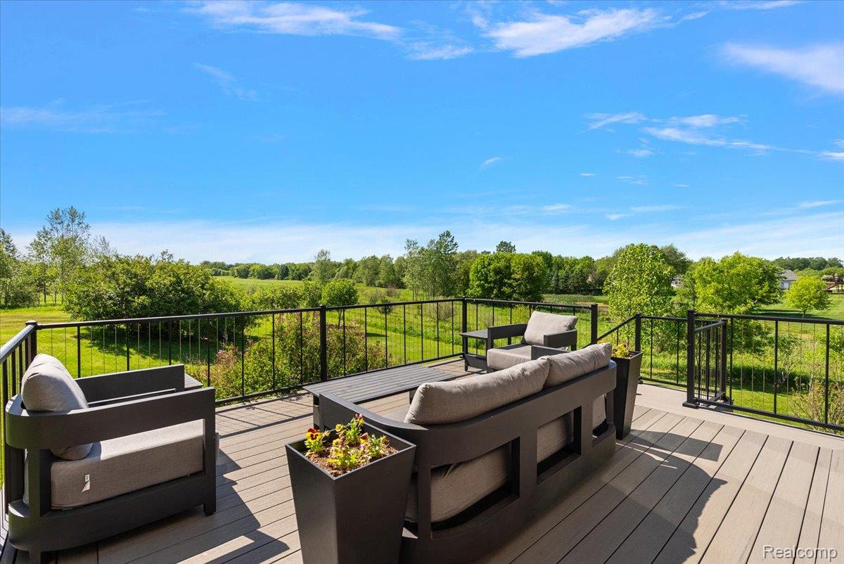 5035 Hidden Ridge Road Metamora, MI 48455 - Photo 7 of 65 Spacious composite deck with black metal railings