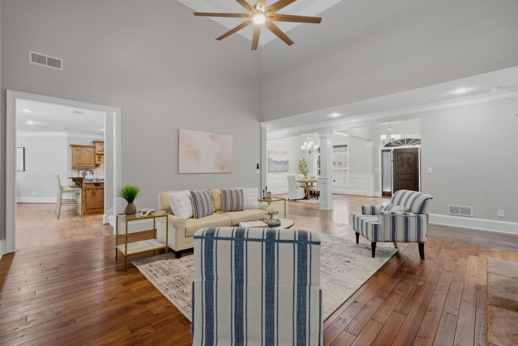 582 Knox Chapel Road Social Circle, GA 30025 - Photo 5 of 49 a living room with furniture and a wooden floor