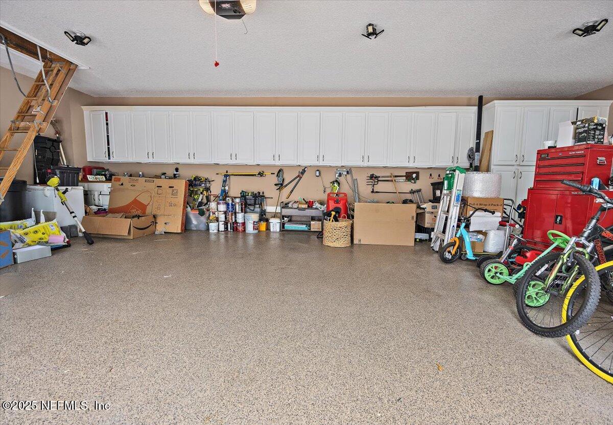 3355 Bishop Estates Road St. Johns, FL 32259 - Photo 54 of 71 64-Garage with Cabinet Storage