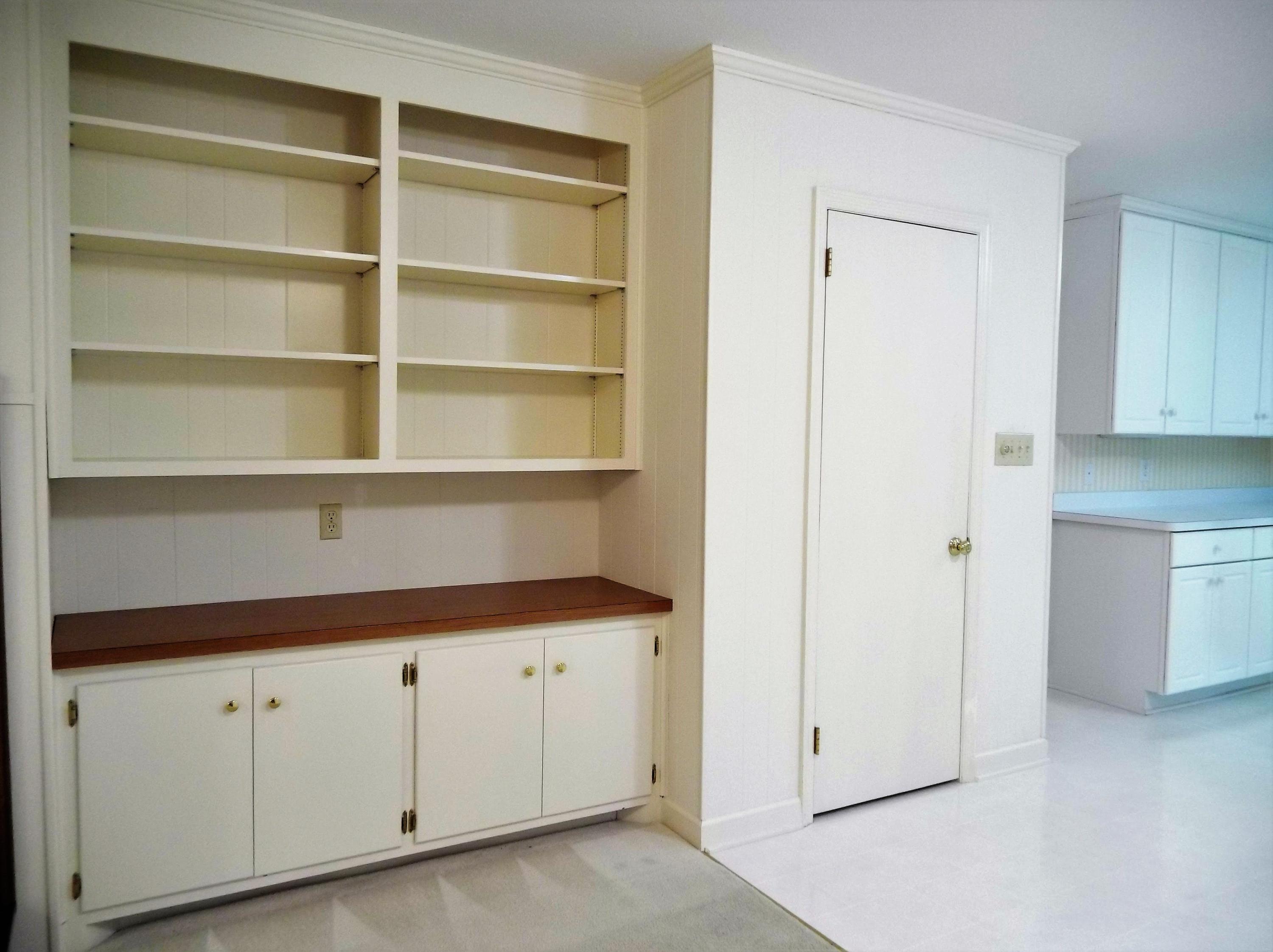 405 Hill Road Southern Pines, NC 28387 - Photo 19 of 35 Built in cabinetry and shelving in the family room. Board games, family photos, favorite novels?? Plenty of space to fill it up.