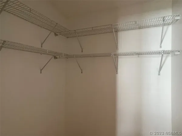 a view of a room with racks on the wall