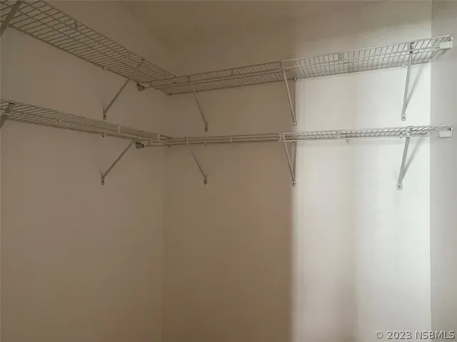 a view of a room with racks on the wall