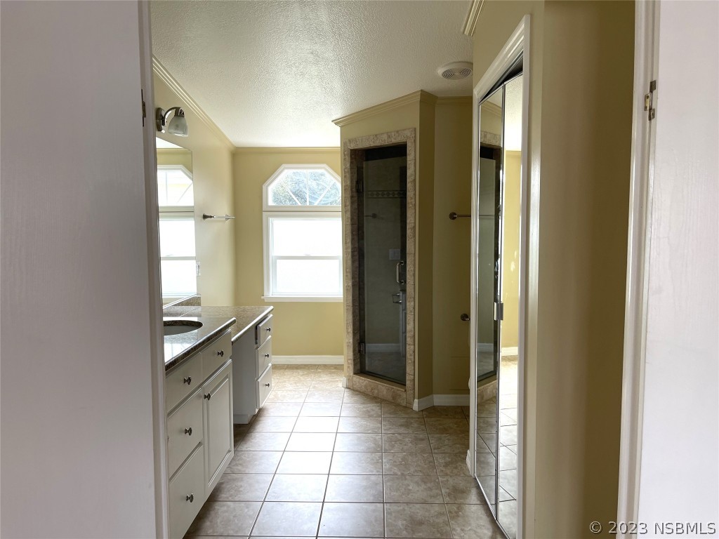 4391 Maple Avenue Edgewater, FL 32141 - Photo 29 of 50 a room with windows and a chandelier