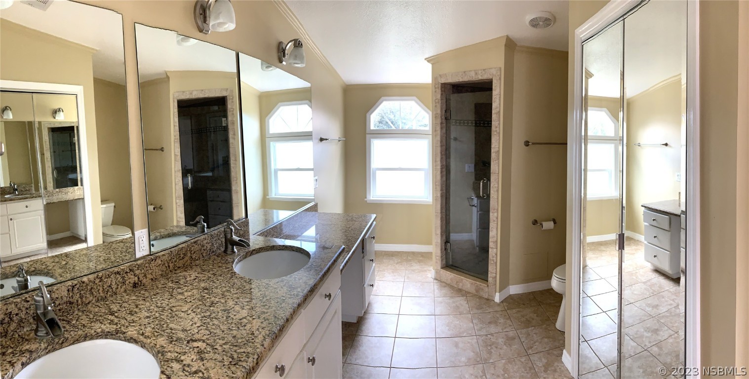 4391 Maple Avenue Edgewater, FL 32141 - Photo 35 of 50 a bathroom with a granite countertop sink and a mirror