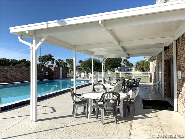 a view of a swimming pool with a patio
