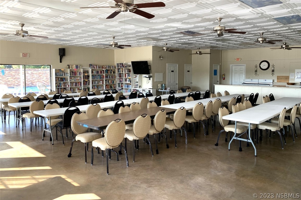 4391 Maple Avenue Edgewater, FL 32141 - Photo 40 of 50 a group of people sitting in a living room