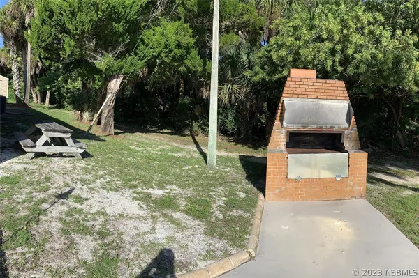 a view of swimming pool with outdoor seating