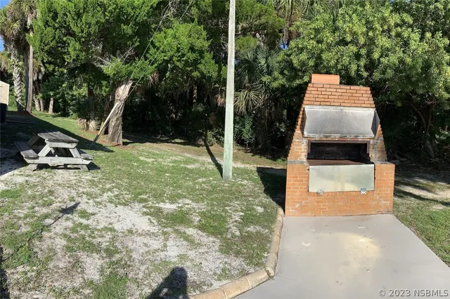 a view of swimming pool with outdoor seating