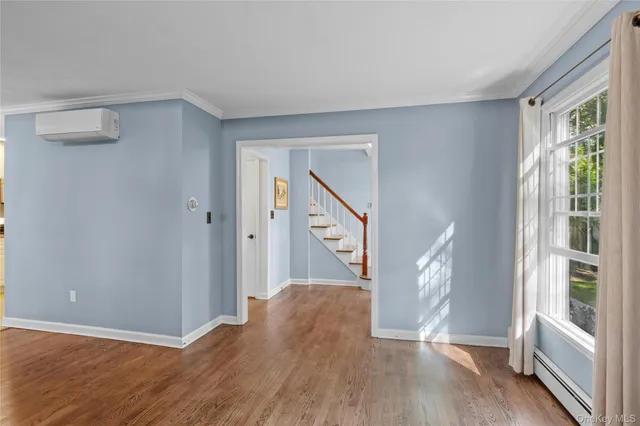 a view of entryway with wooden floor