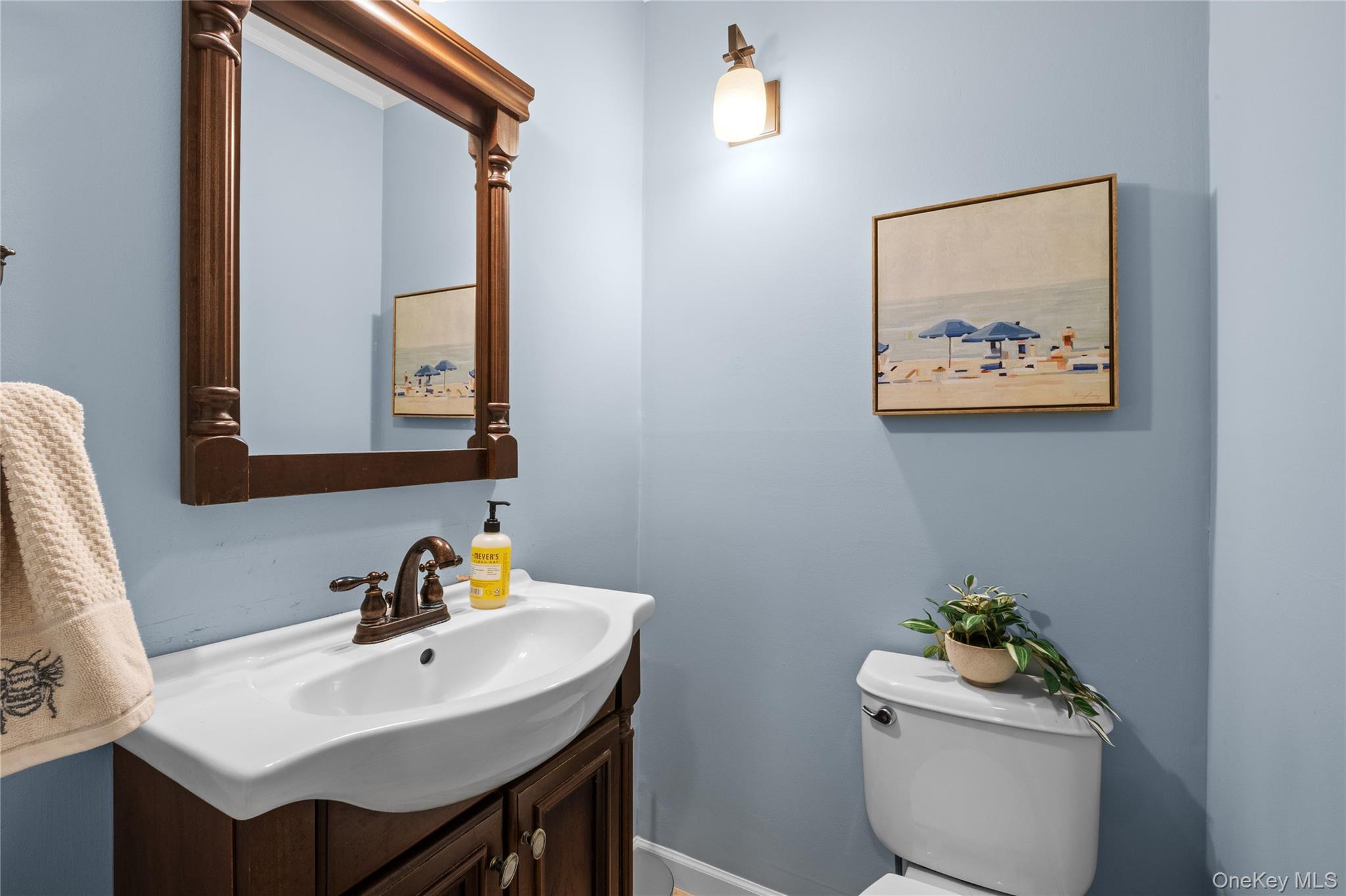 7 Shaker Hollow Road Setauket, NY 11733 - Photo 19 of 38 a bathroom with a sink mirror and toilet