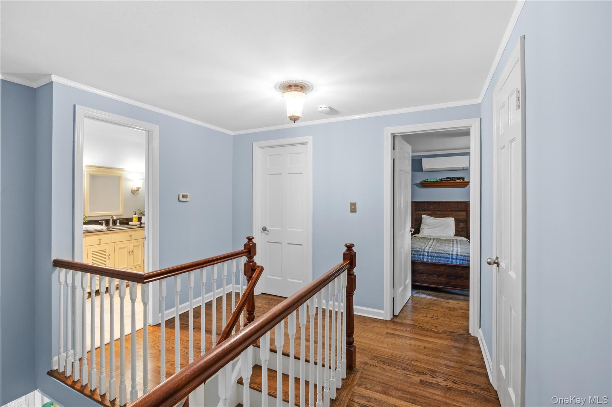 7 Shaker Hollow Road Setauket, NY 11733 - Photo 20 of 38 a view of a hallway with wooden floor and entryway