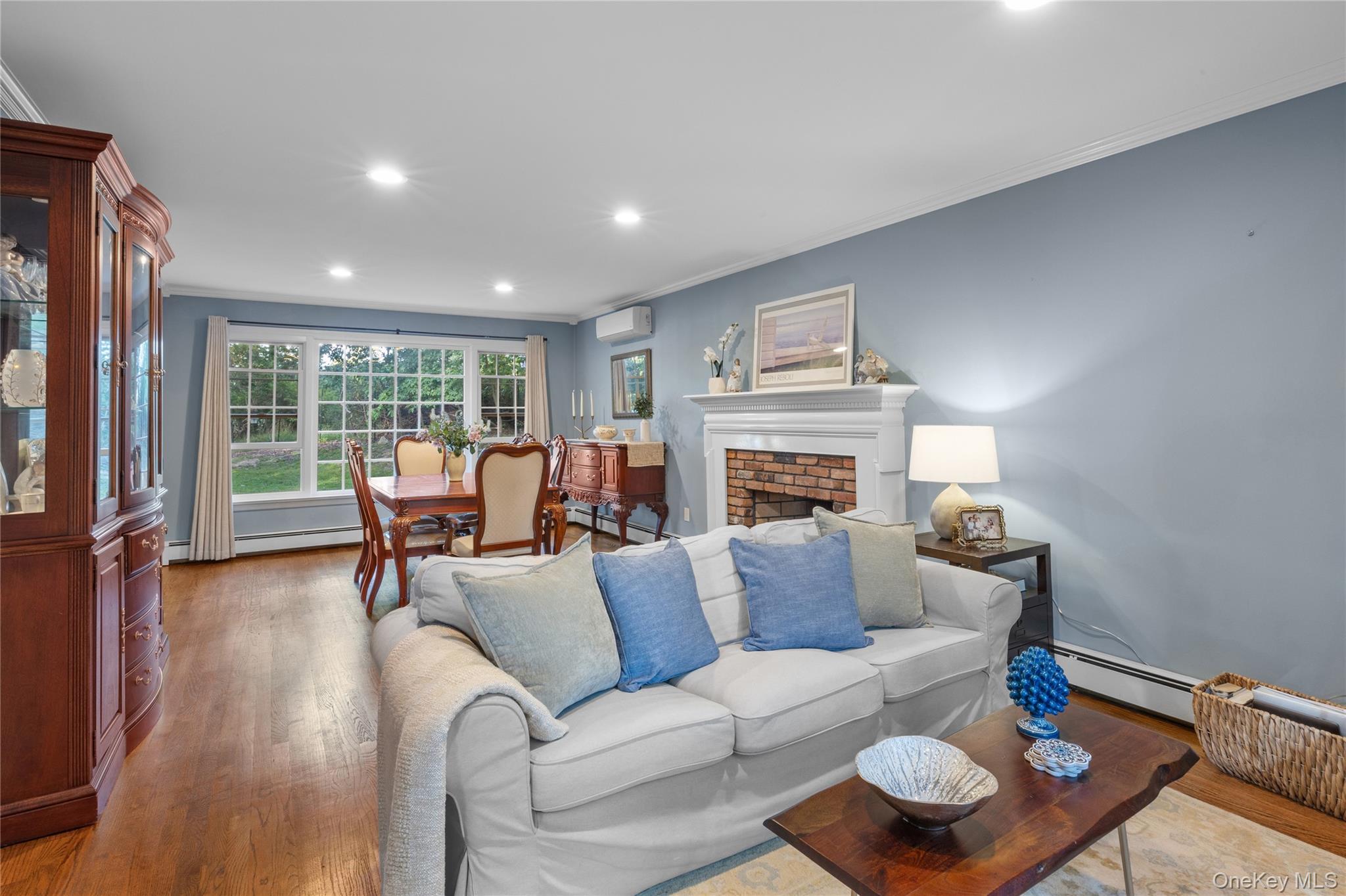 7 Shaker Hollow Road Setauket, NY 11733 - Photo 5 of 38 a living room with furniture and a fireplace