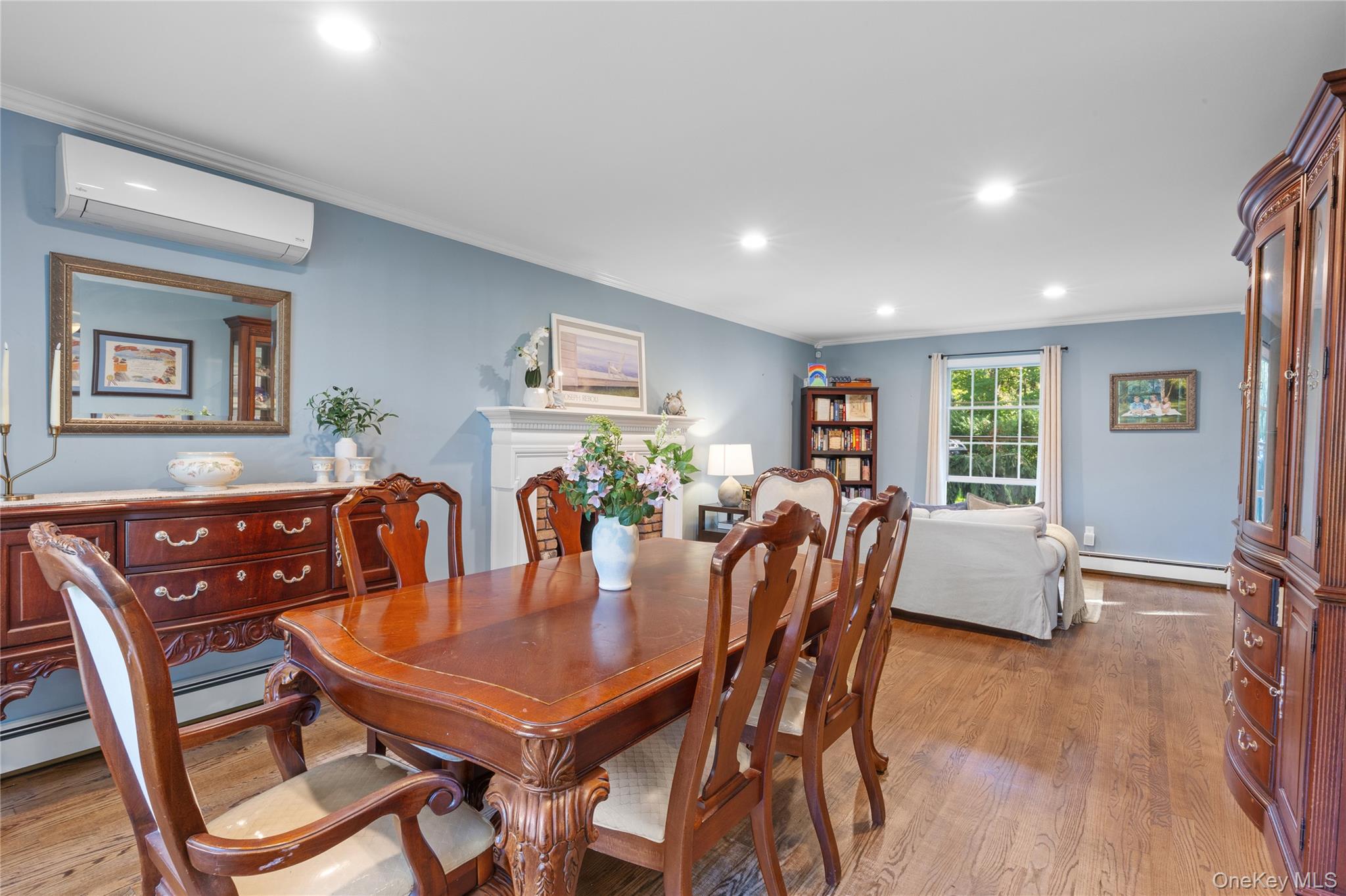 7 Shaker Hollow Road Setauket, NY 11733 - Photo 9 of 38 a view of a dining room with furniture and wooden floor