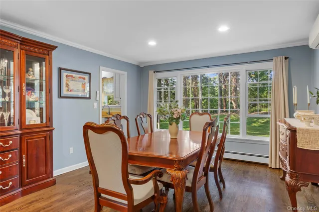 a dining room with furniture window wooden floor