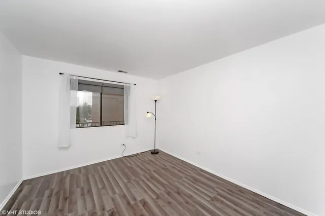 a view of wooden floor in an empty room