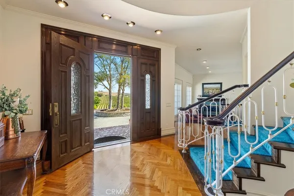 a view of kitchen with stainless steel appliances cabinets and a refrigerator
