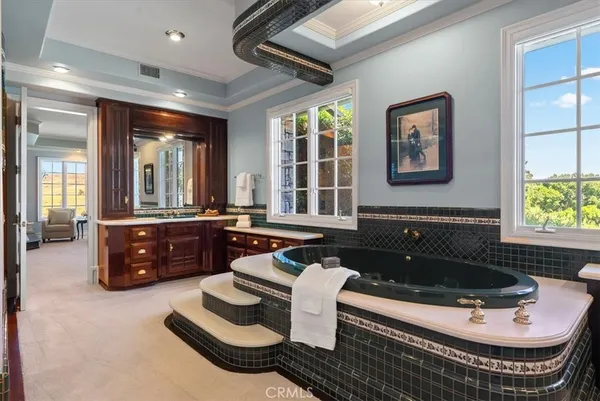 a bedroom with a bed chair and window