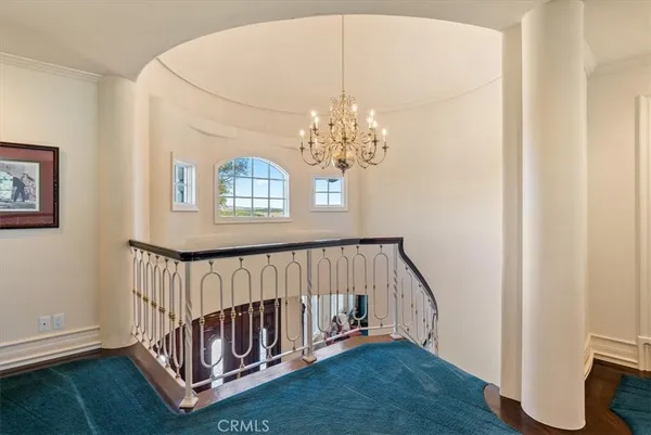 a view of a yard with flower plants and wooden fence